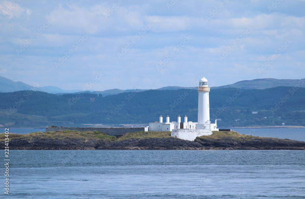 The picturesque Eilean Musdile Lighthouse, situated in the Sound of Mull in the beautiful Scottish Highlands.