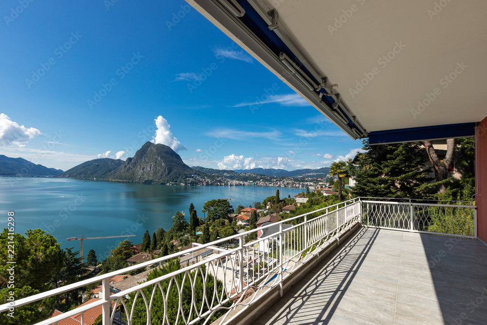 Balcony overlooking Lake Lugano on a summer day