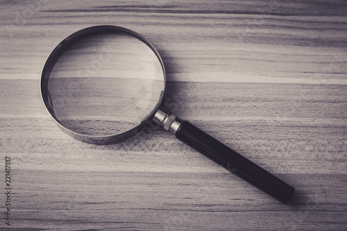 Magnifying Glass On The Wooden Table