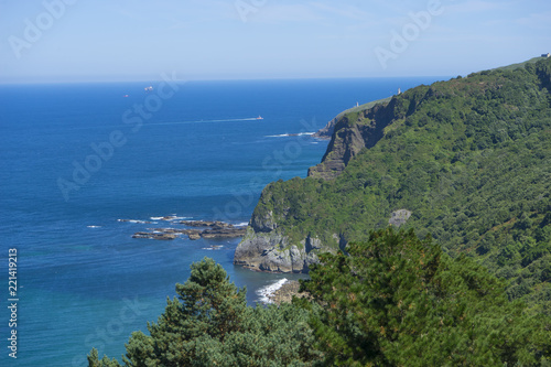 Summer sea, San Juan Gaztelugatxe island view, basque country, historical island with chapel in Northern Spain