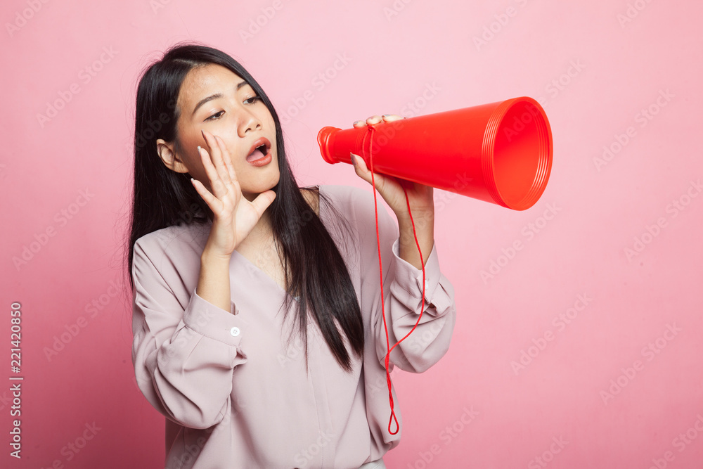 Beautiful young Asian woman announce with megaphone. Beautiful young Asian woman announce with megaphone.