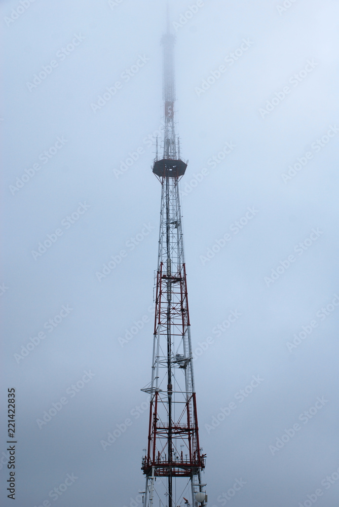 TV Tower in fog. Foggy morning in Lviv, Western Ukraine. Cold and wet spring weather. TV Tower in fog. Foggy morning in Lviv, Western Ukraine. Cold and wet spring weather.