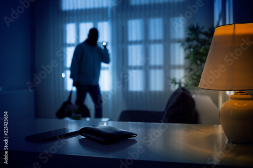 Burglar or intruder inside of a house photo