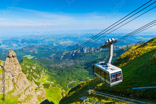 cable car on the ropes, going to Mount Kasprowy Wierch, Poland. Beautiful view of the valley