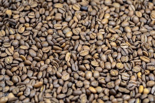 The roasted coffee beans lie on the table. Arab coffee beans. Morning coffee.