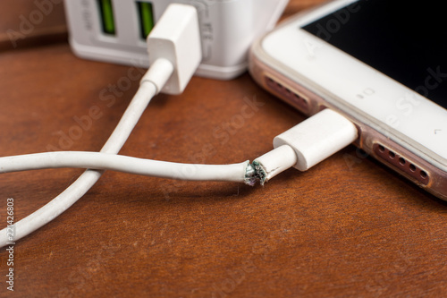 Broken charger cable with smart phone