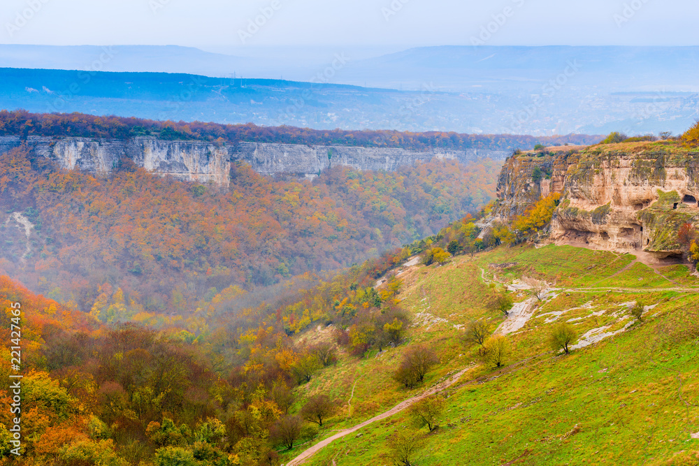 Obraz premium The cave city of Chufut-Kale and the valley on a cloudy autumn day, Crimea, Russia
