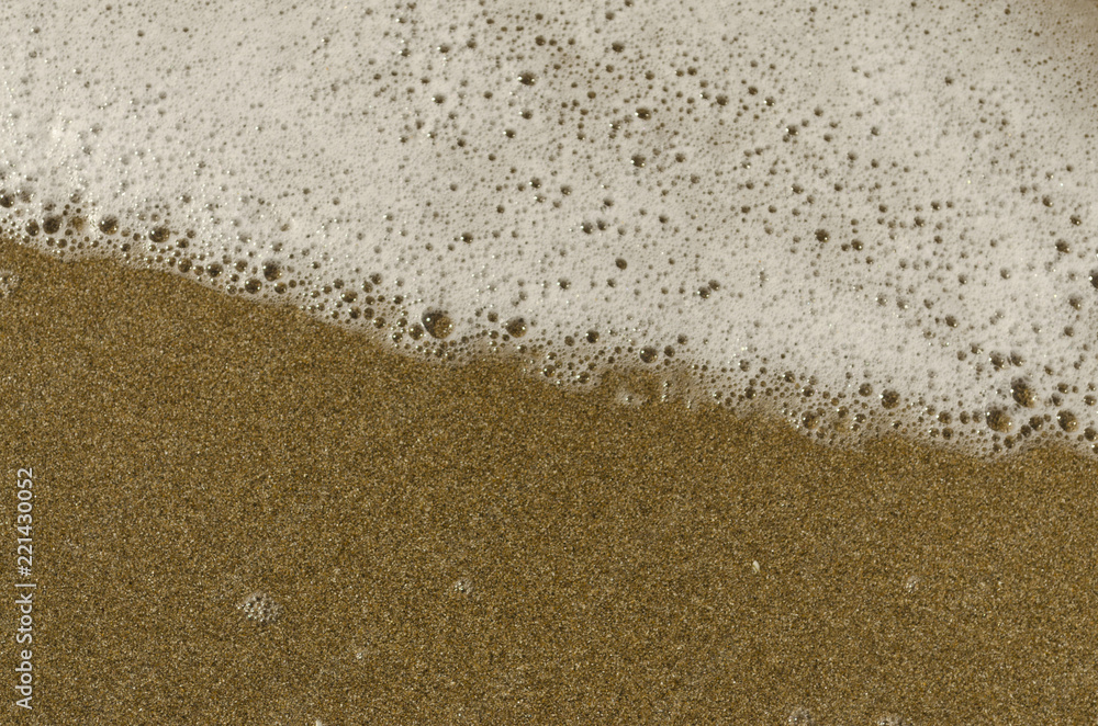 sea foam on the sand sea foam on the sand