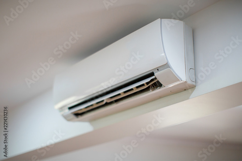 Close up of an Air Conditioner on a white wall