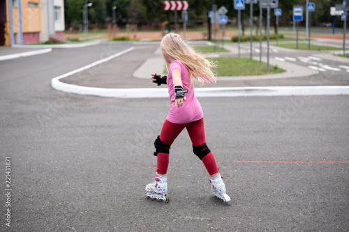 active lifestyle in a modern city - active lifestyle in a modern city - stylish girl roller-blading in a stadium © zayatssv