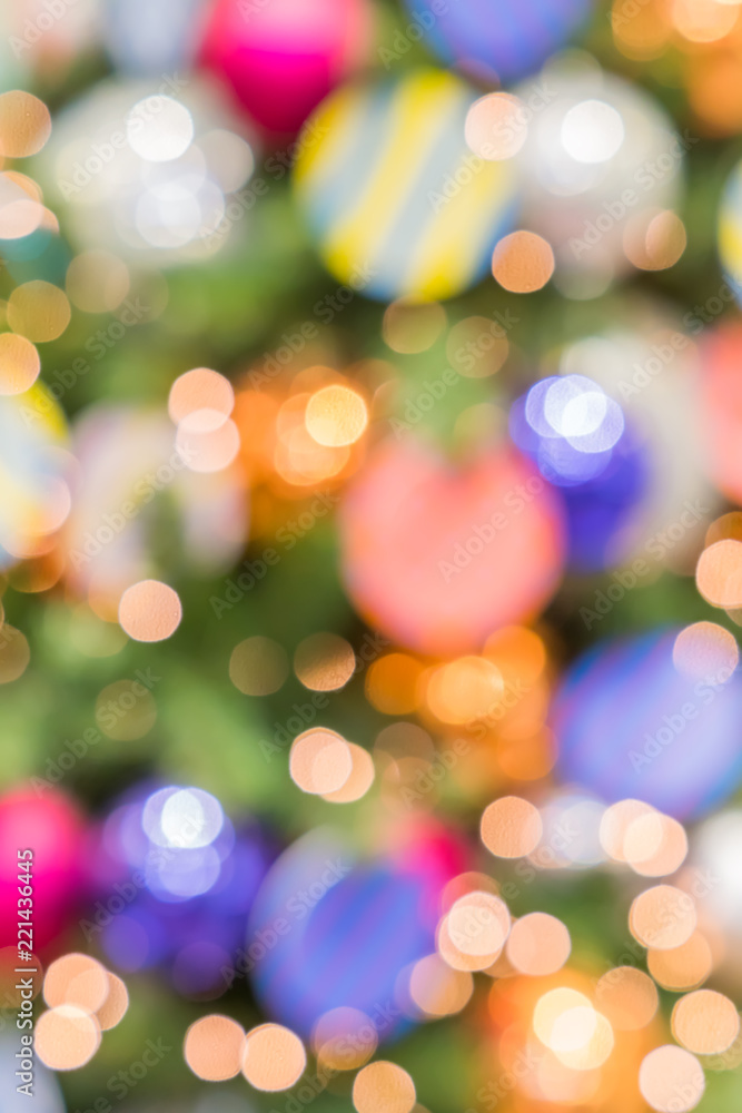 Obraz premium abstract blurred lights on background in blue, purple, orange colors. - christmas celebration concept