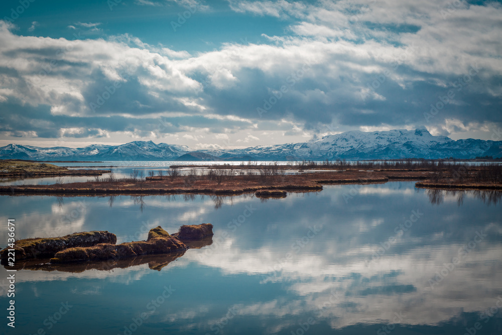 Clouds Reflected in Lake Thingvellir With Snowy Mountains in the Background, Iceland