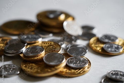 Macro shot detail of golden and silver color coin stacks on dark background with copy space for text. Business and finance growth, saving money, investment and interest concept.