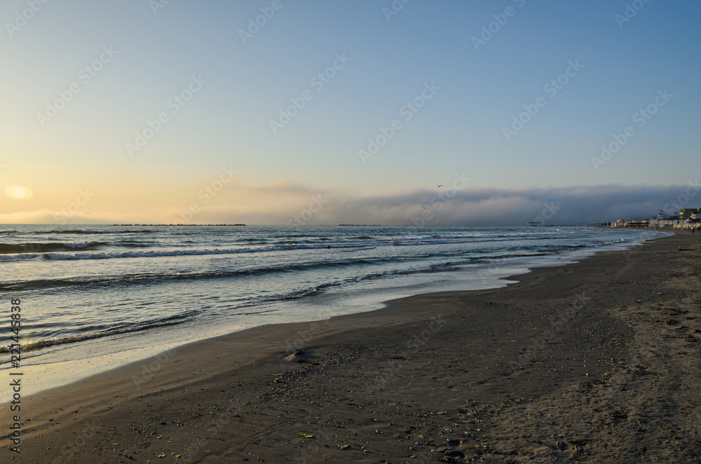 Beach of Black Sea from Mamaia, Romania at sunrise , warm sunshine atmosphere Beach of Black Sea from Mamaia, Romania at sunrise , warm sunshine atmosphere