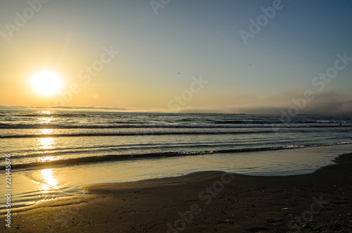 Fototapeta Naklejka Na Ścianę i Meble -  Beach of Black Sea from Mamaia, Romania at sunrise , warm sunshine atmosphere