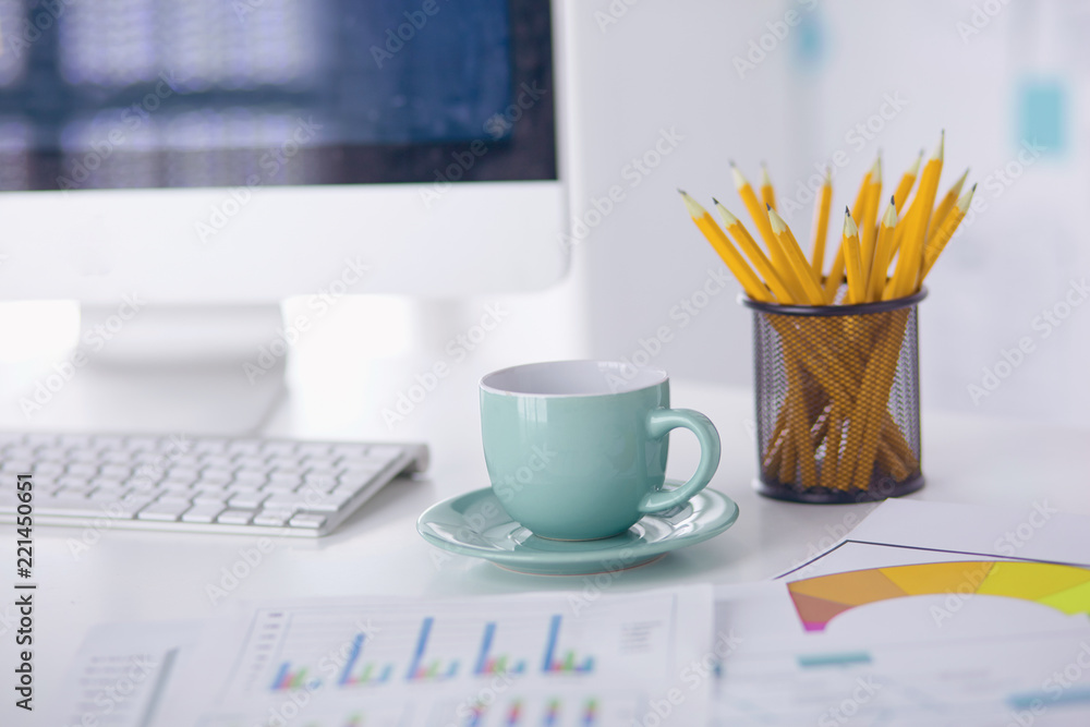 A cup of coffee on the office table A cup of coffee on the office table