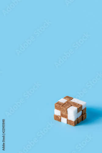 Wallpaper Mural cube made of white and brown sugar cubes isolated on blue background Torontodigital.ca