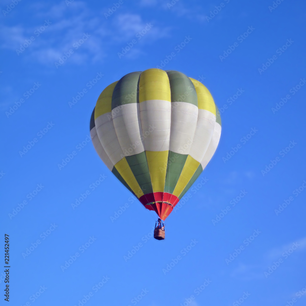 Fototapeta premium balloon with two passengers rises into the sky