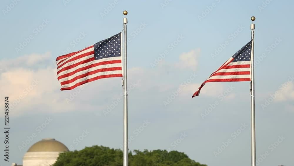 Description
Two large flags of the United States of America fluttering in the wind on flag poles in 4x slow motion. Description
Two large flags of the United States of America fluttering in the wind on flag poles in 4x slow motion.