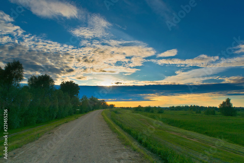 Country road at sunset in summer. Kostroma, Russia.
