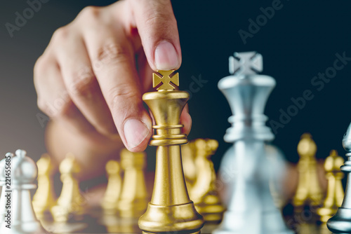 businessman hand control chess play figure business strategy manage ideas concept retro image tone