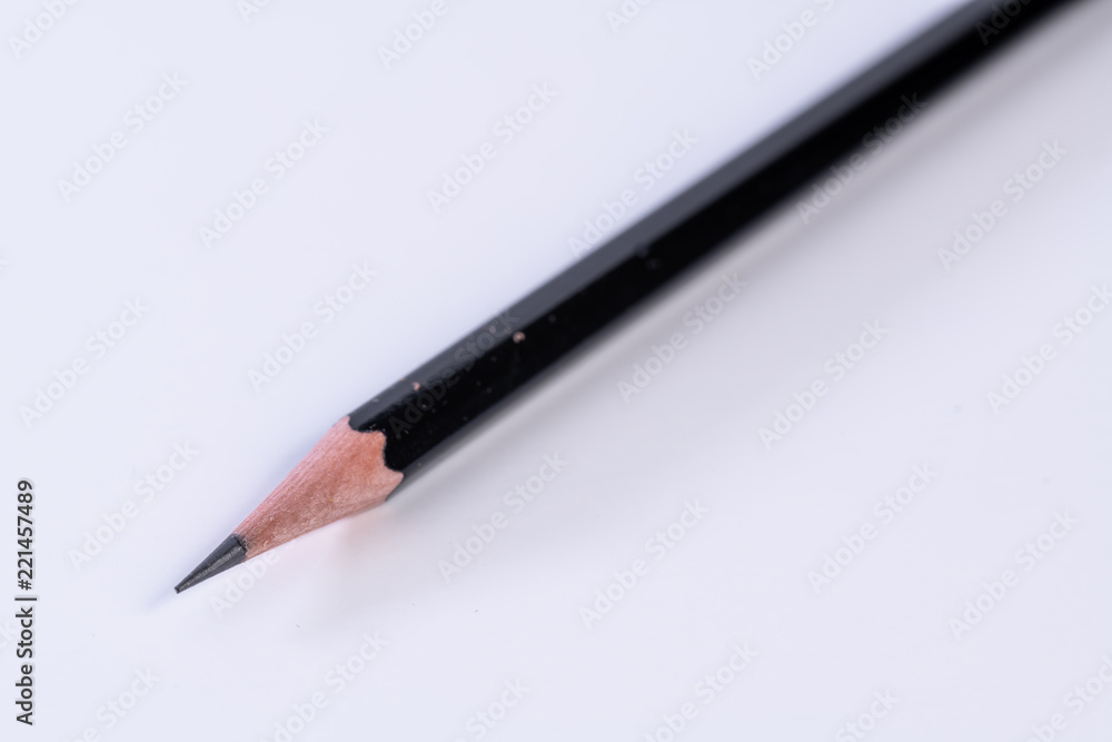 Single isolated black lead graphite pencil with a white background Single isolated black lead graphite pencil with a white background