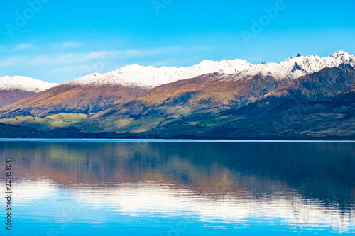 Stunning beautiful view beside lake Wanaka with alps mountain. Noon scenery with blue sky.