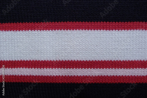 striped knitted fabric close-up black red white rift cloth