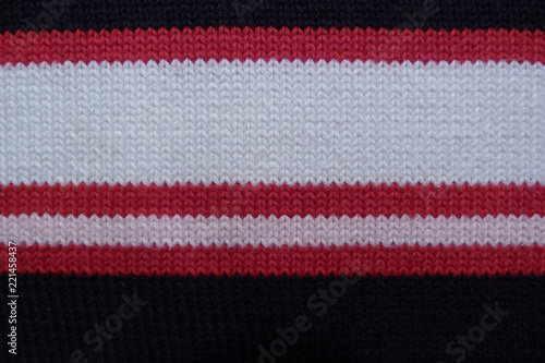 striped knitted fabric close-up black red white rift cloth