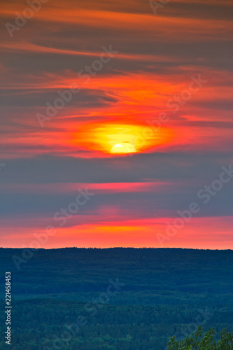 The sun setting over the forest of Prince Albert National Park.