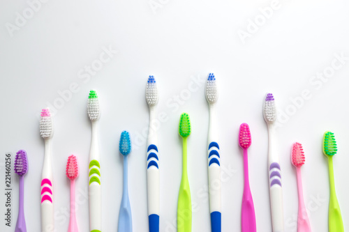 Top view,flat lay of toothbrushes in colorful on white background.