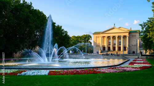 Grand Theatre -  neoclassical opera house located in Poznań, Poland - in the rays of the setting sun photo