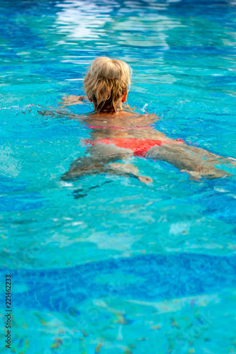 Woman exercising water aerobics
