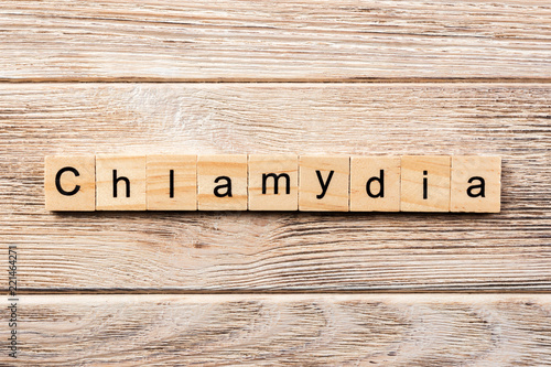 chlamydia word written on wood block. chlamydia text on table, concept photo