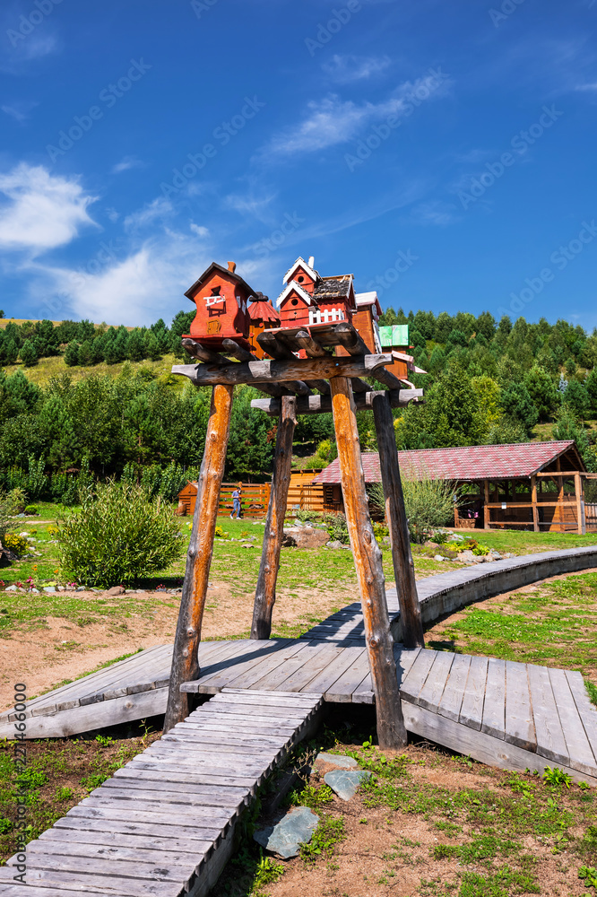The territory of the arboretum, houses for birds. The Village Of Altai, Gorny Altai, Southern Siberia The territory of the arboretum, houses for birds. The Village Of Altai, Gorny Altai, Southern Siberia