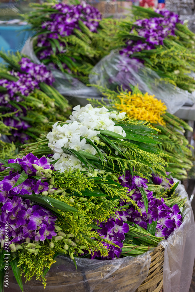 Stacks of fresh flowers for sale at the Yodpiman Flower Market (also known as Bangkok Flower Market, Talad Pak Klong) in Bangkok, Thailand. Stacks of fresh flowers for sale at the Yodpiman Flower Market (also known as Bangkok Flower Market, Talad Pak Klong) in Bangkok, Thailand.