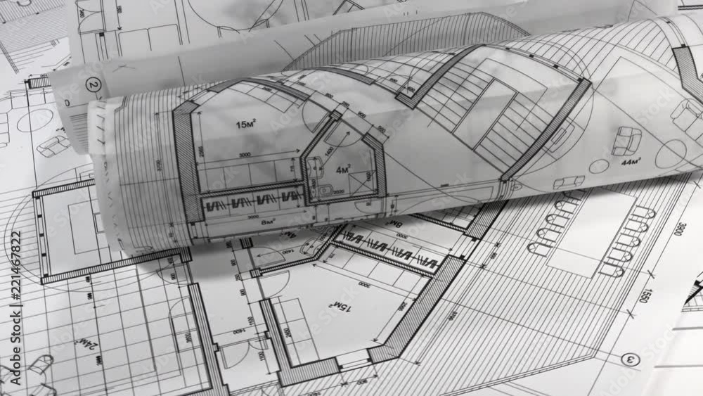 Blueprints - rolls of architectural drawings smoothly rotate on the ...
