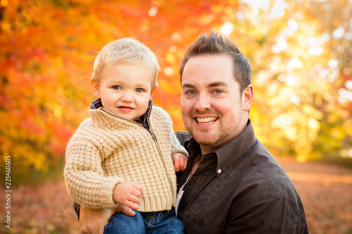 Happy Father and Son in Autumn Park