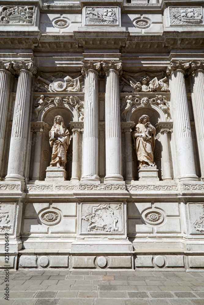 Baroque, white architecture with ancient statues and columns background in a sunny day in Italy