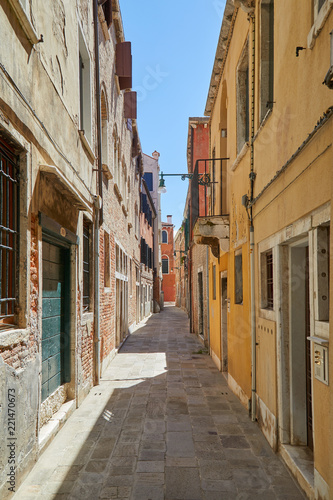 Venice alley  buildings and houses facades  nobody in a sunny day in Italy