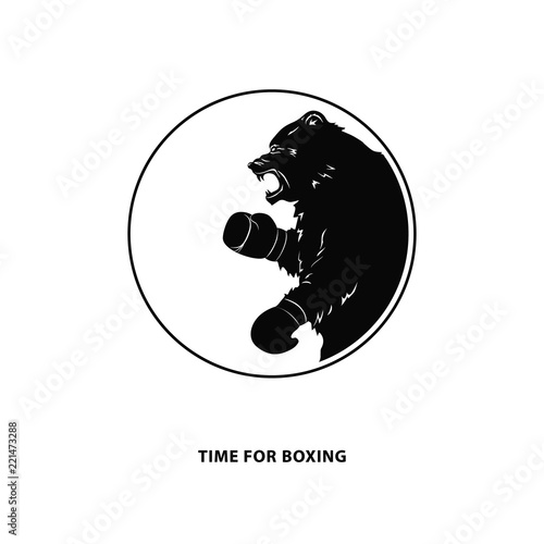 Black bear in Boxing gloves. Silhouette of a wild animal. Round emblem of a snarling beast for sport event. Art design. Vector illustration