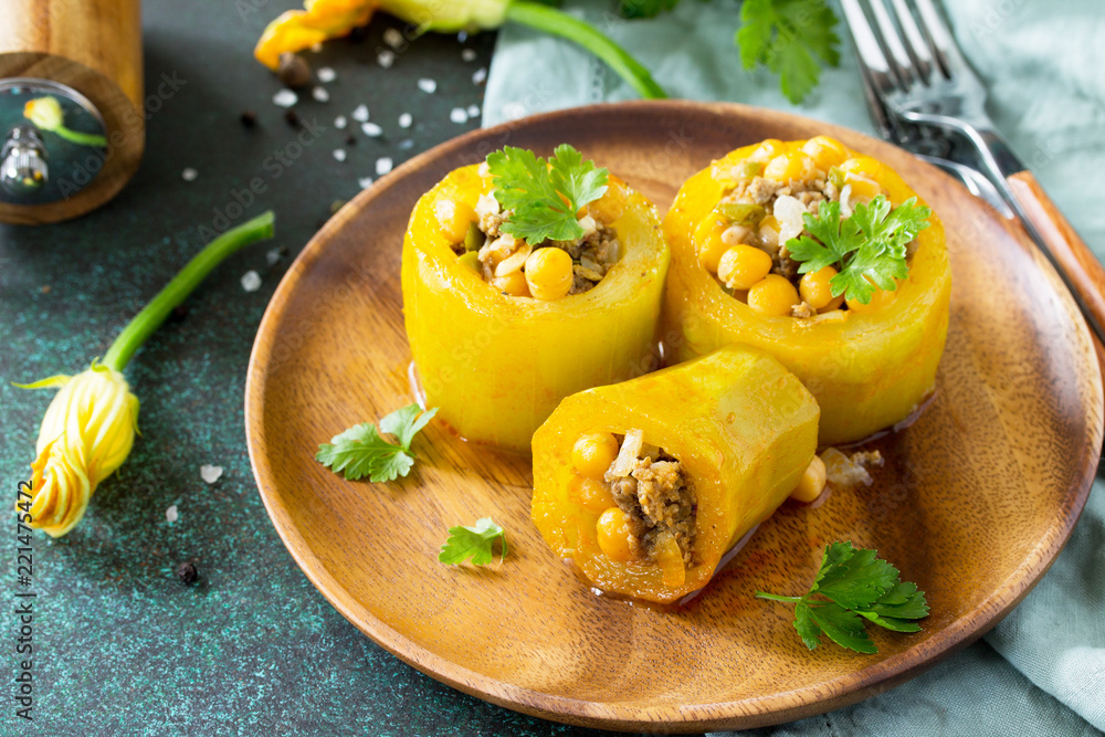 Healthy food: Baked Zucchini Stuffed - with chickpea and Meat on a stone or slate background. Diet menu. Healthy food: Baked Zucchini Stuffed - with chickpea and Meat on a stone or slate background. Diet menu.
