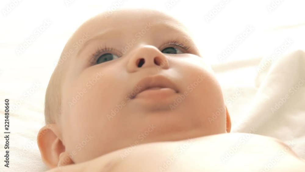 Little baby in bed, close-up shot Little baby in bed, close-up shot