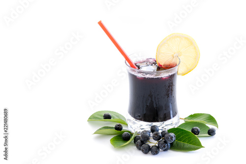Fresh juice of chokeberry (Aronia melanocarpa) in glass and berry and leaves near, isolated on white background