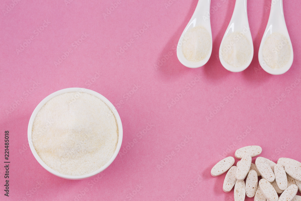 Pills and collagen protein powder - Hydrolyzed. Top view Pills and collagen protein powder - Hydrolyzed. Top view