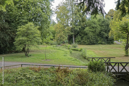 Rastatt, Germany - a summer park with a wooden bridge.