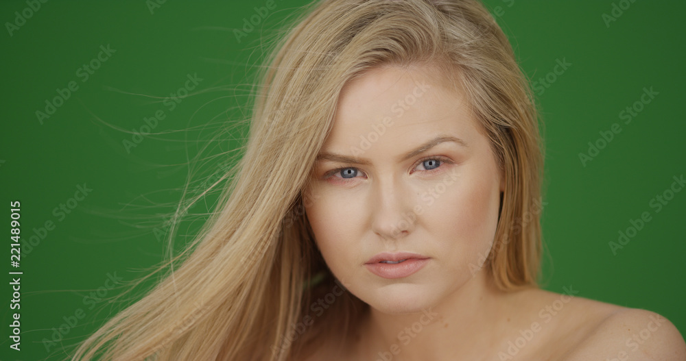Portrait of attractive blonde female model posing on green screen Portrait of attractive blonde female model posing on green screen
