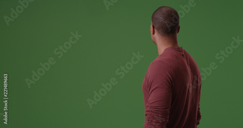 African American looking away from camera on green screen