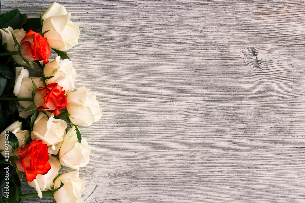 Roses on a wooden background