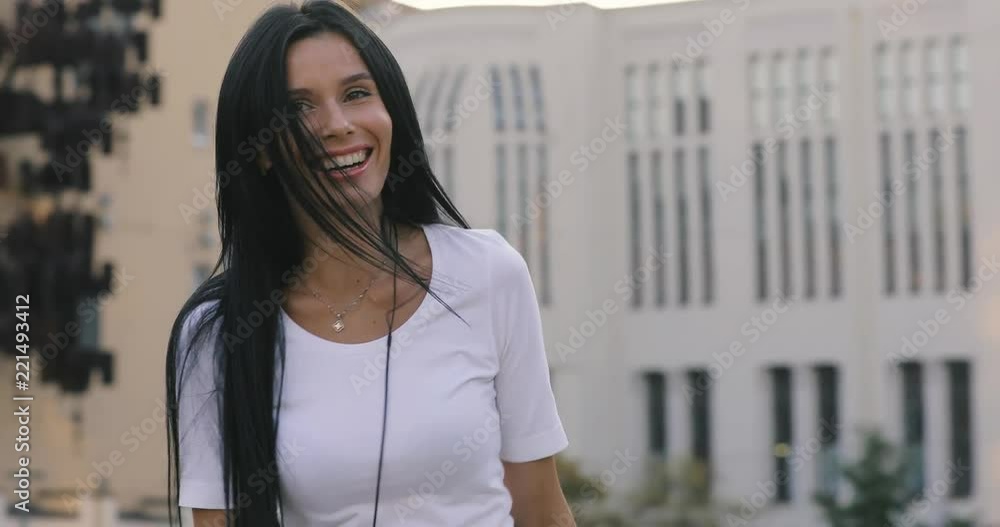 Fun woman dancing twerk in the city